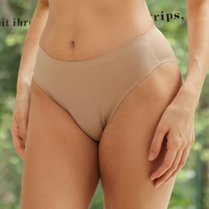 Close-up of seamless nude thong with laser-cut edges and high-cut fit on model