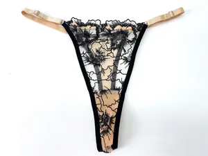 Close-up of black floral lace G-string with adjustable champagne gold elastic waist straps