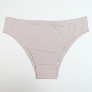 Close-up of seamless light pink panties showing smooth laser-cut edges and soft fabric