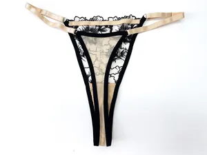 Detailed view of sexy black lace floral G-string with delicate champagne gold elastic straps