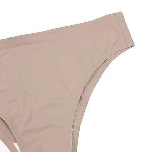 Detail of skin-toned seamless underwear showing reinforced side stitching and soft cotton lining