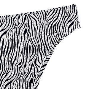 Macro shot of zebra print fabric texture and fine stitching on women underwear