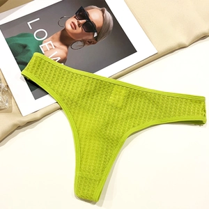 Detail of neon green waffle texture low-rise cotton underwear with seamless edges