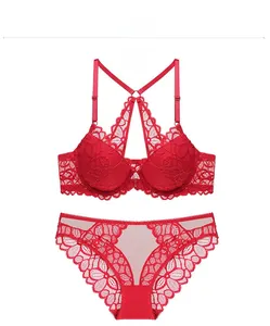 Flat lay of red floral lace lingerie set featuring front buckle bra and matching panties