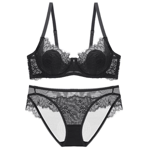 Elegant black lace lingerie set with sheer mesh and underwire bra on white background