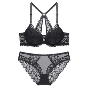 Sexy black lace lingerie set with front closure bra and matching briefs on white background