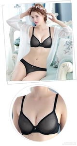 Detailed view of sheer black lace lingerie set featuring breathable mesh and scalloped edges