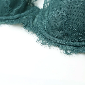 Lace bra set in deep green with delicate eyelash trim and supportive underwire