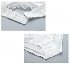 Detail of white lace bra with 3-row hook closure and soft cotton lining panty