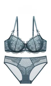 Detail view of teal lace lingerie set with 3D cups and delicate bow shoulder straps