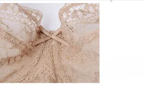 Close-up of beige lace bra featuring delicate floral patterns and a small center bow detail