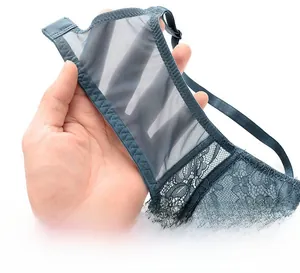 Detail of breathable elastic side wings of grey-blue lace bra showing sheer mesh texture