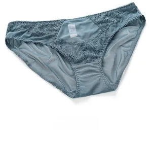 Detailed close-up of grey-blue eyelash lace panties with delicate mesh and scalloped edges