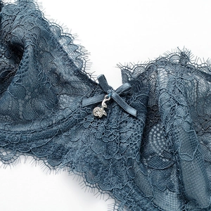 Navy blue lace bra set with floral patterns and sparkling metal charm decoration