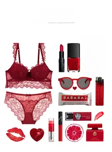 Detailed flat lay of a red lace lingerie set with elegant wave embroidery and makeup