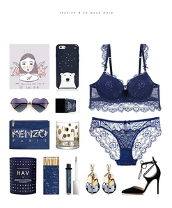 Flat lay of a dark blue lace lingerie set with floral bra and matching mesh panties