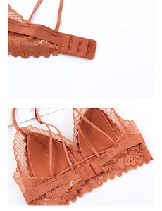 Detailed view of caramel lace bralette featuring cross-back straps and back closure
