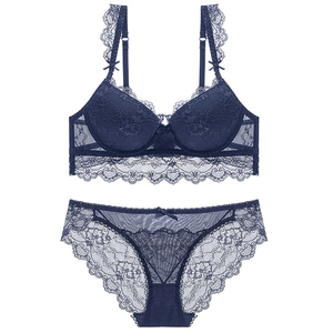 Lace lingerie set with floral patterns and bow details in deep blue color