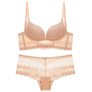 Lace-trimmed push-up bra and panty set in nude color featuring smooth seamless cups