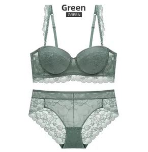 Macro shot of green lace lingerie set with push-up bra and matching panties details