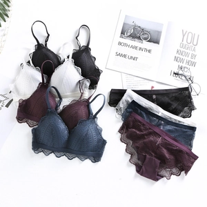 Detailed set of French triangle lace bras and matching panties in four classic colors