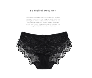 Détail de culotte en dentelle noire avec motifs floraux délicats et nœuds en satin