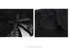 Gros plan détaillé de la dentelle florale noire et du mesh avec un nœud en satin