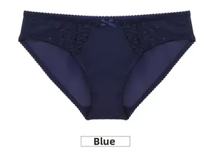 Detailed view of navy blue silk panties with elegant lace embroidery and a small bow