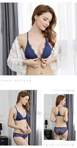 Detailed macro of dark blue lace triangle bra with front closure and Y-back strap design