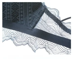 Detail showing elastic band and intricate navy floral lace on wireless bralette