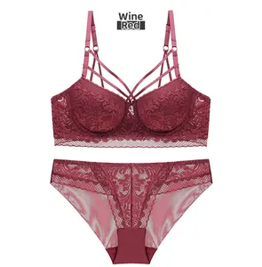 Detailed view of wine red lace bra set with elegant mesh stitching and crisscross straps