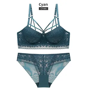 Detail of grey blue lace lingerie set with strappy design and floral mesh texture