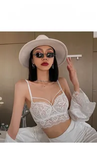 Close-up of white floral lace embroidery on a French-style ultra-thin sexy bralette