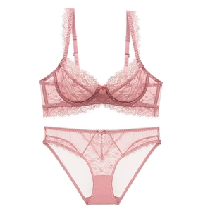 Detailed view of dry rose pink lace bra and matching panties with sheer mesh texture