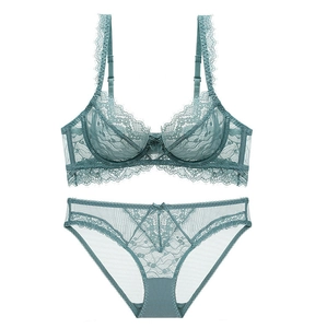 Close-up of sage green lace lingerie set with eyelash lace trim and bow details