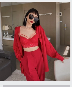 Three-piece red lace bralette set with oversized shirt and high-waisted wide-leg trousers