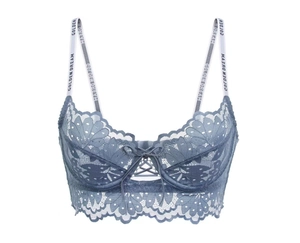 Close-up of light blue floral lace bra with branded straps and a delicate bow detail