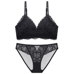 Detail view of black lace lingerie set featuring floral embroidery and scalloped edges