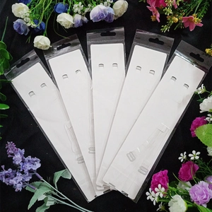 Five pairs of clear TPU bra straps in individual retail packaging with hanging holes