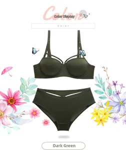 Dark green push-up bra set featuring criss-cross straps and matching hollow panties