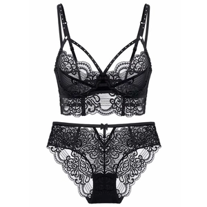 Close-up of black eyelash lace lingerie set with intricate floral patterns and strappy details