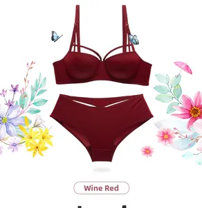 Flat lay of wine red lingerie set with glossy push-up bra and strappy panties details