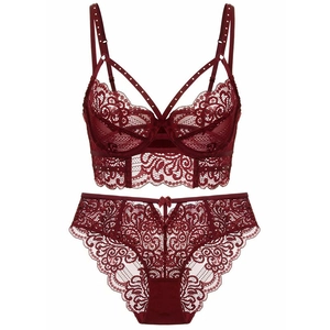 Lace lingerie set in deep red featuring floral embroidery and cross strap details