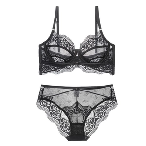 Detail of black floral lace lingerie set with sheer mesh and scallop edge embroidery