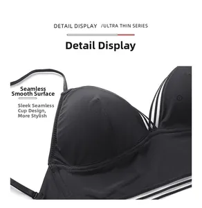 Close-up of black seamless triangle bra with striped side wings and thin straps
