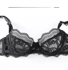 Close-up of black floral lace bra detailing with scalloped edges and silk ribbon bow