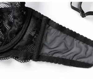 Detail view of black lace bra with side support wings and adjustable shoulder straps