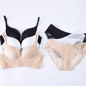 U-shaped backless seamless bra set with lace trim in black, white, and nude colors