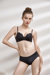 Detail of black seamless deep V bra set with sheer mesh panels and double straps