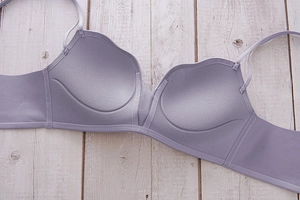 Detail of lavender seamless deep V bra with scalloped edges and cat paw cups